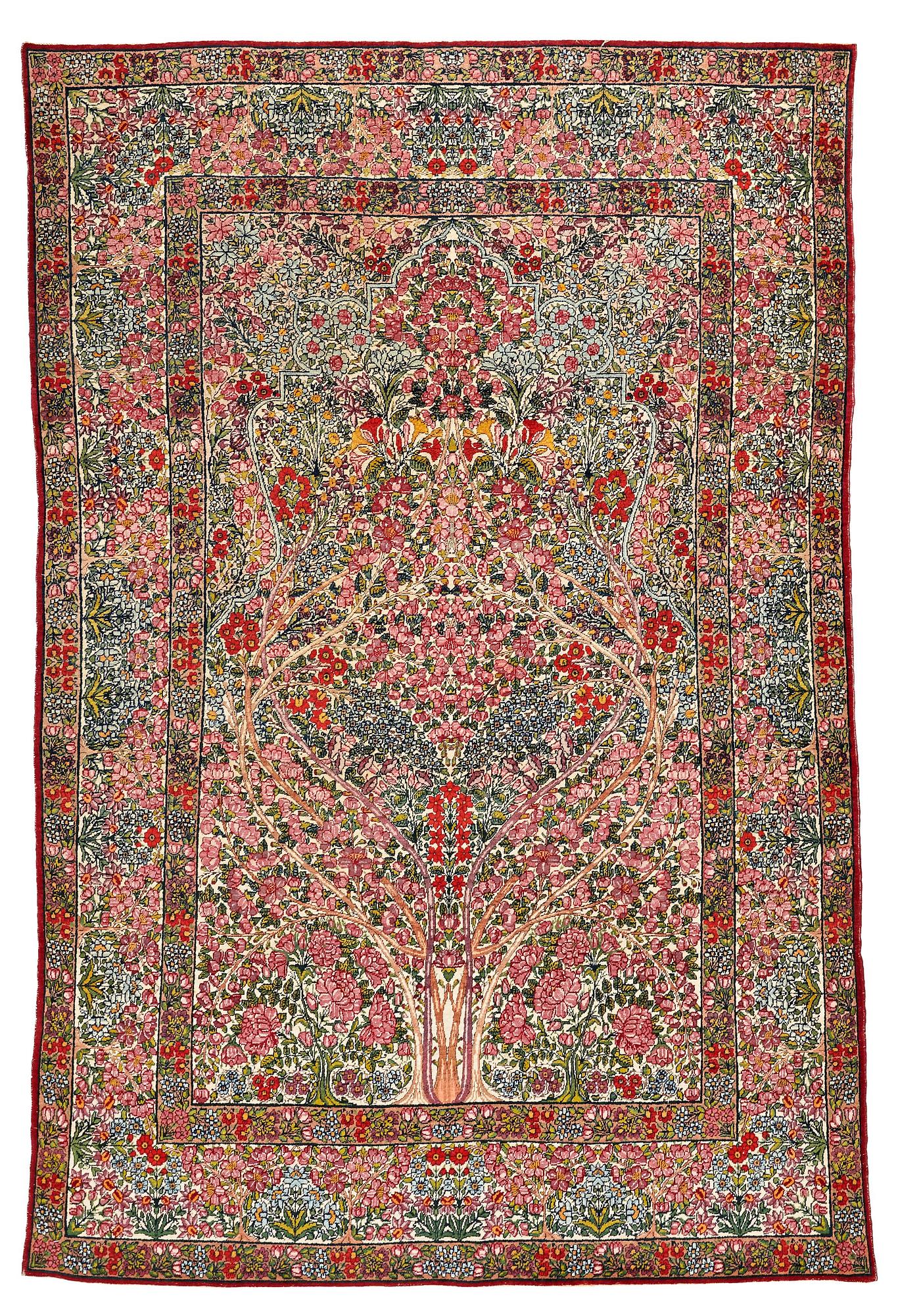 A RUG, a semi-antique Kerman "mille-fleur", ca 198,5 x 136,5 cm.