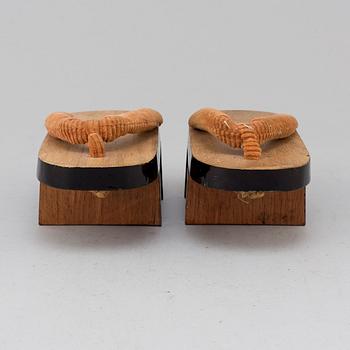 A pair of Japanese 'Geta' shows and two Chinese pouches, early 20th century.