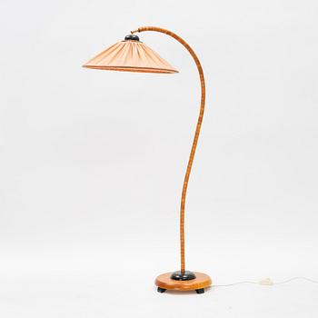 A stained beech floor light, Markslöjd, late 20th Century.