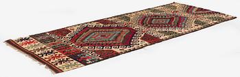 An antique Central Anatolian kilim, c. 273 x 101 cm.