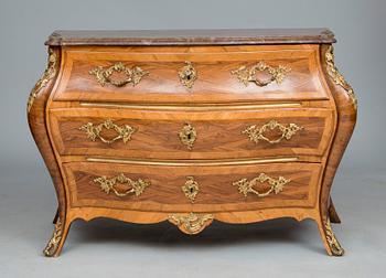 A ROCOCO CHEST OF DRAWERS.