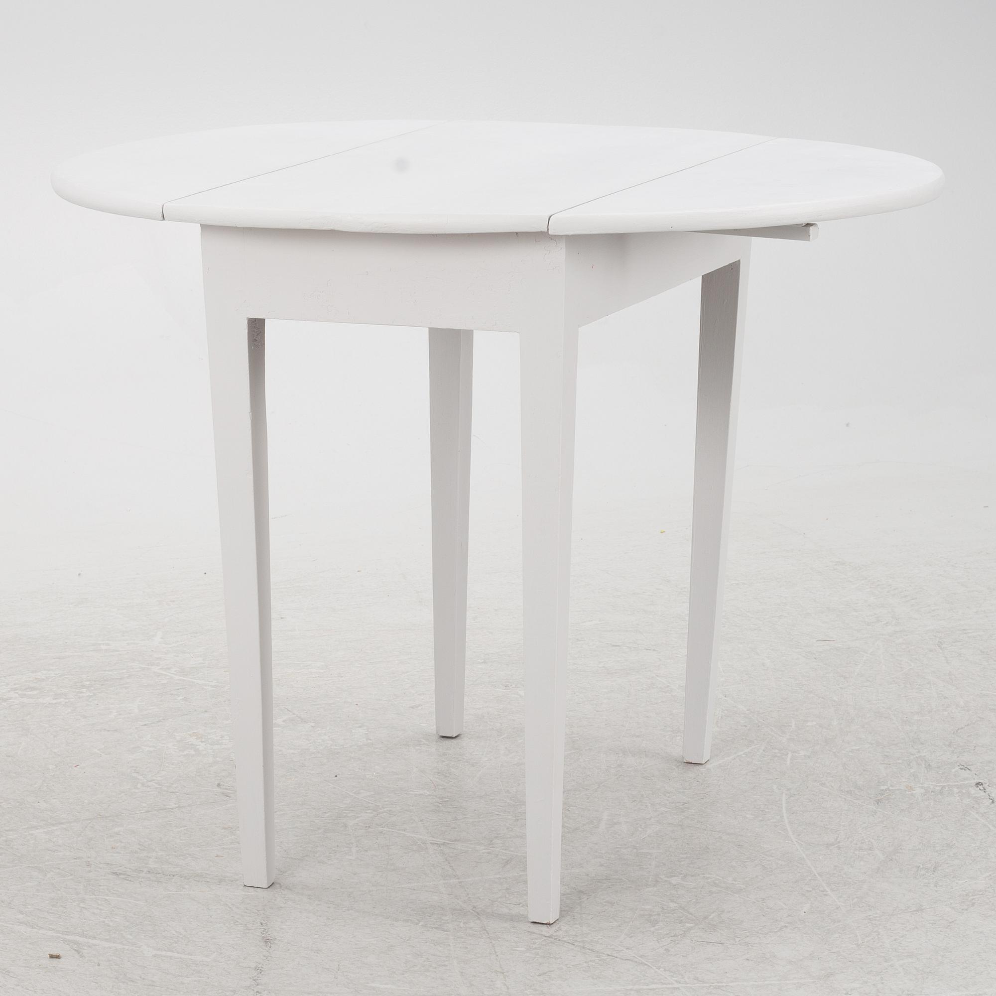 A drop-leaf table, late 19th Century.