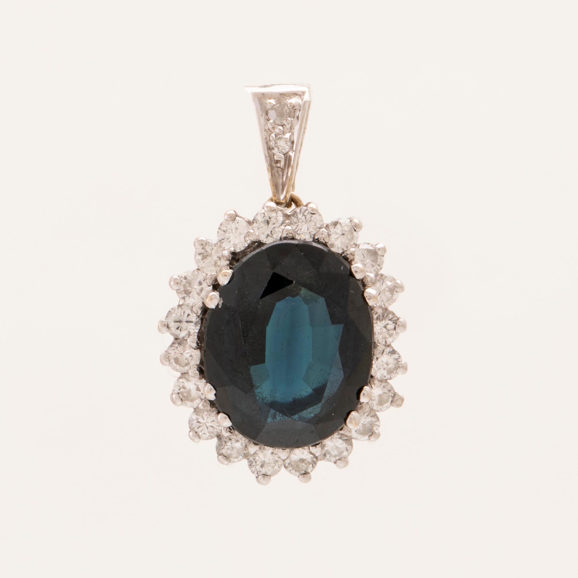 Pendant in 18K white gold with an oval faceted sapphire and round brilliant and single-cut diamonds.
