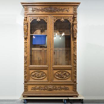 a oak vitrine cabinet from the late 1800's.
