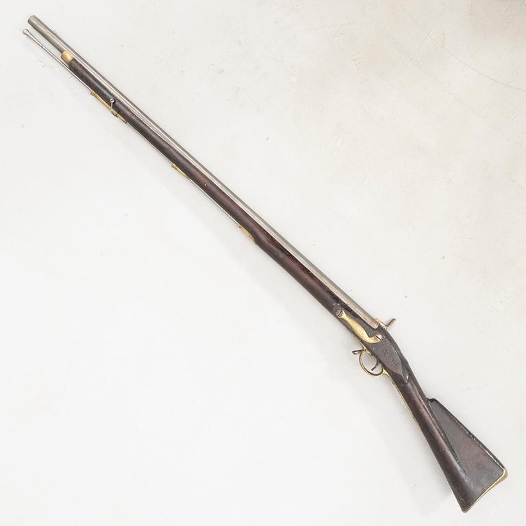 Slaglåsgevär, brittiskt svenskt, ändrat från flintlås.