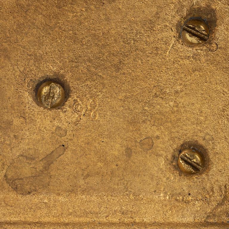 A pair of brass candleholders, 20th century.