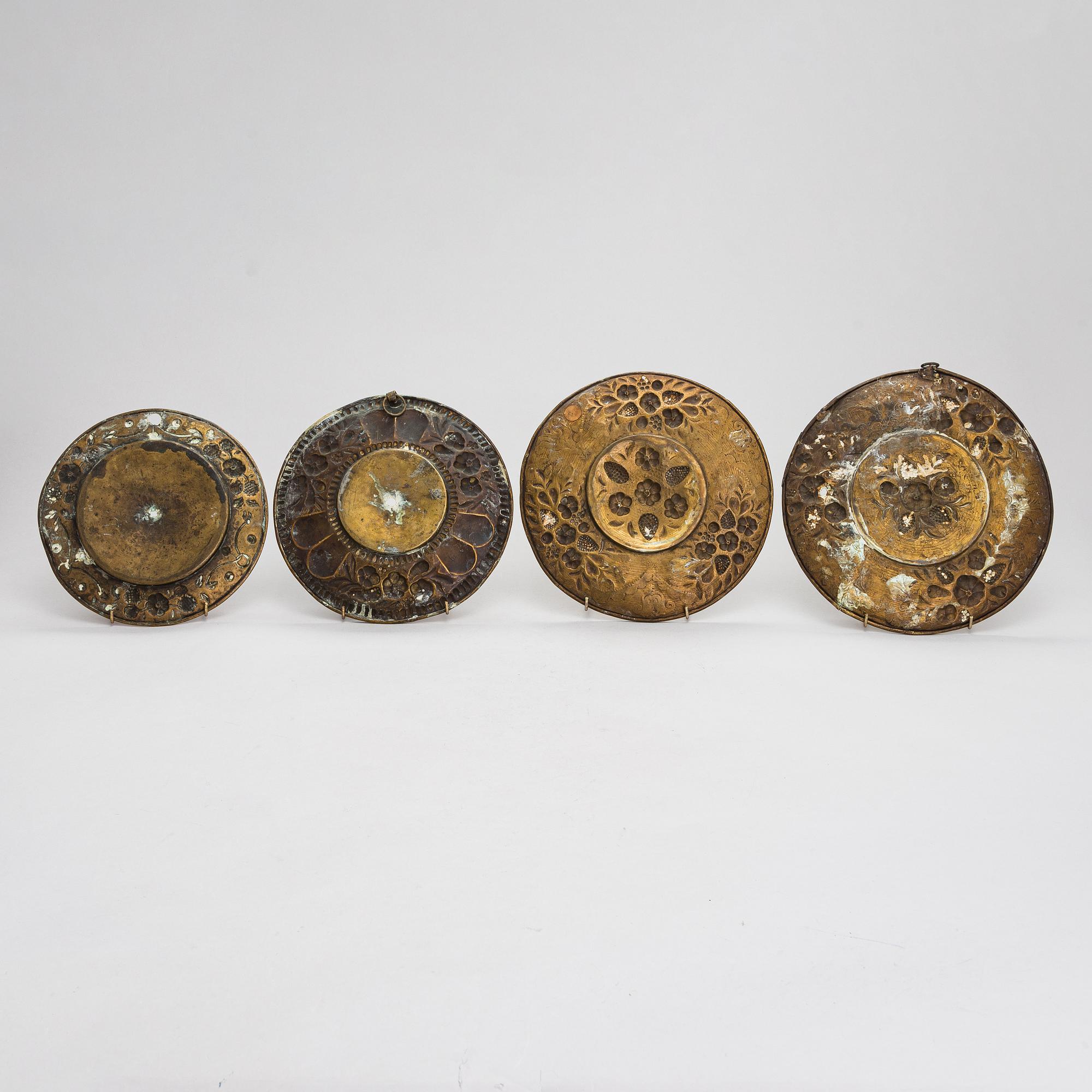 Four mid-17th century Northern and Central European reflectors plates.
