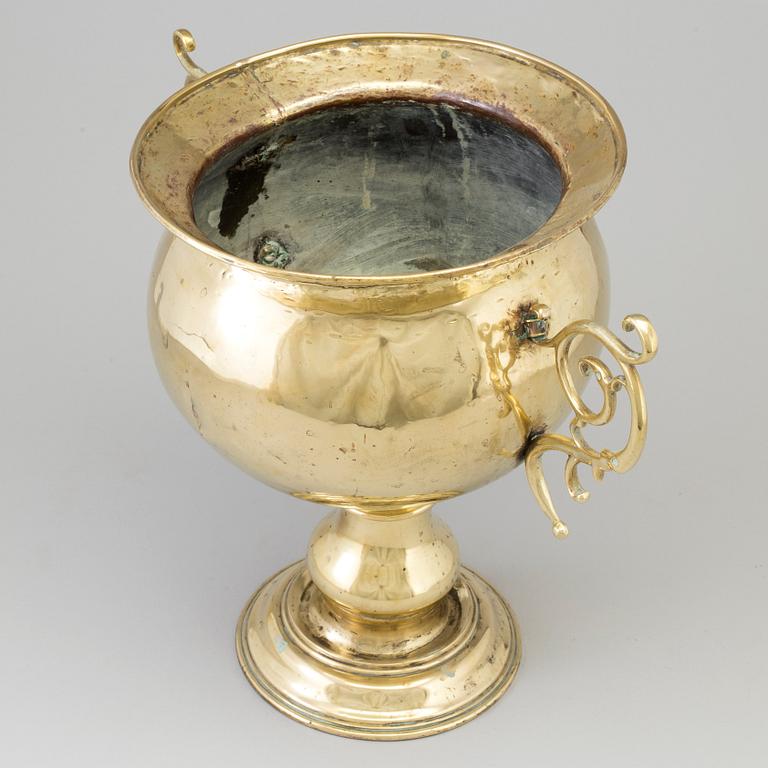 A 19th century brass champagne cooler.