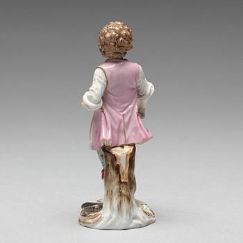 A Meissen figure of a young boy with grapes, 1890's.