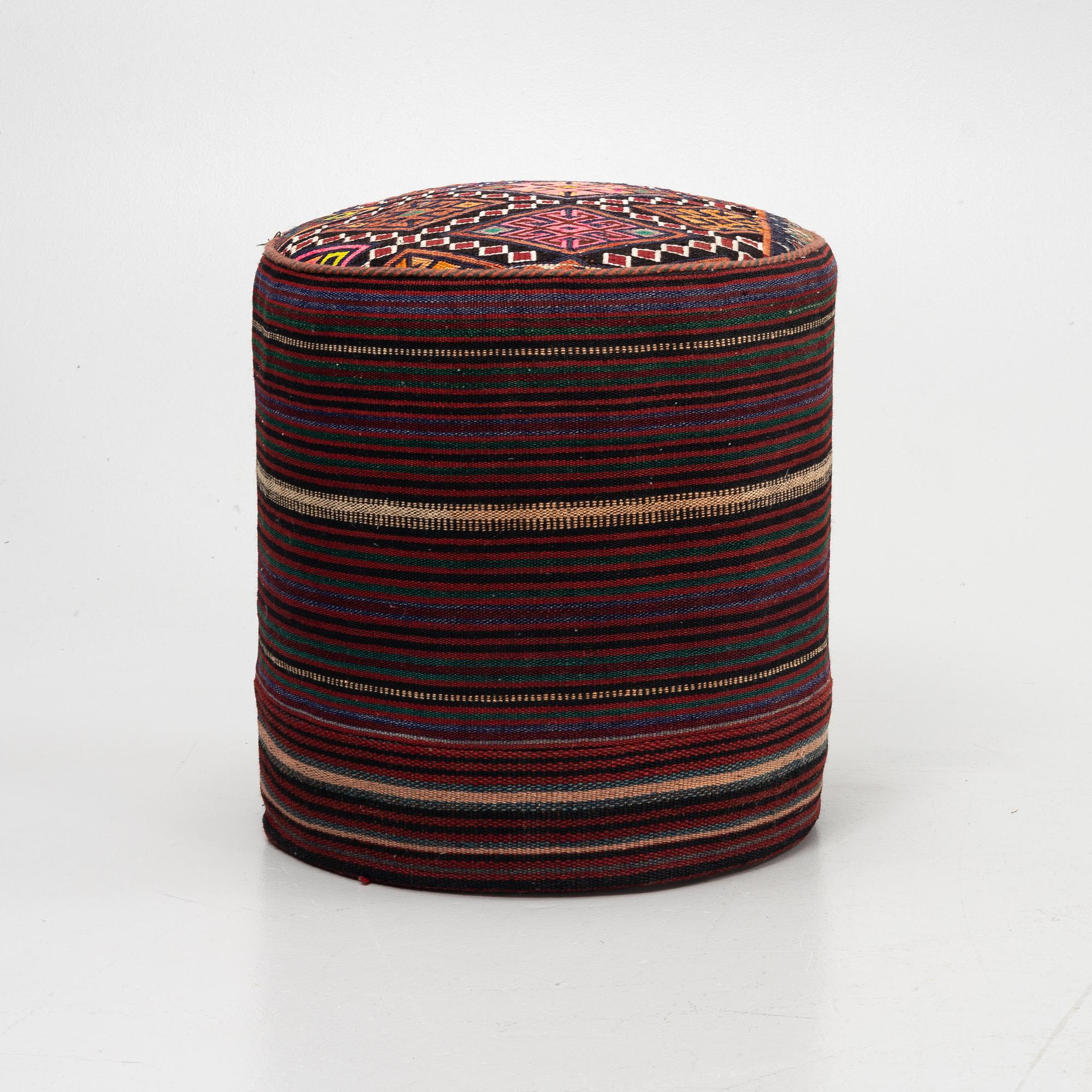 A Kelim covered stool.