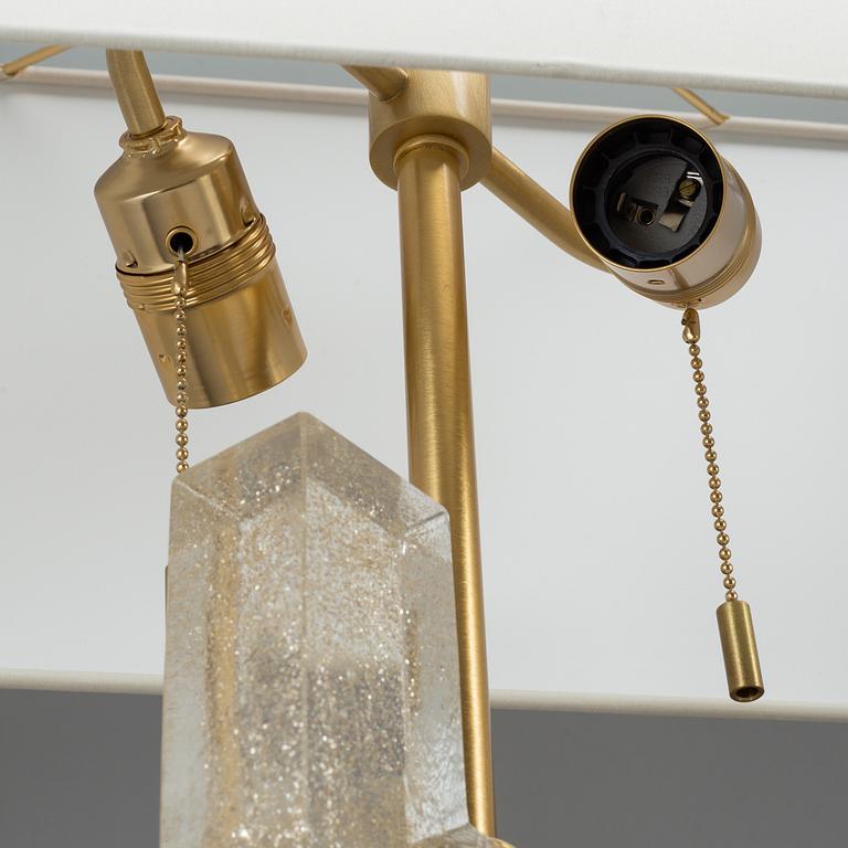 A 'Esha Alta' glass and brass table lamp from Donghia lightning.