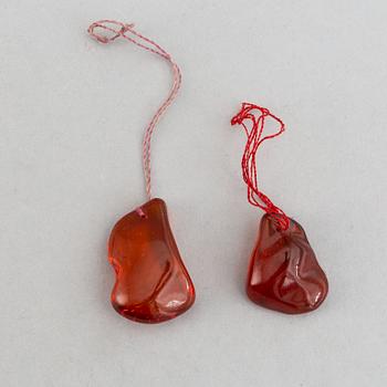 A group of amber objects, China, 20th Century. (14 small pieces).