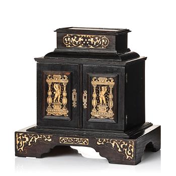 159. A South German, presumably Augsburg, ebony, ebonised and engraved bone inlaid table cabinet,  17th century.