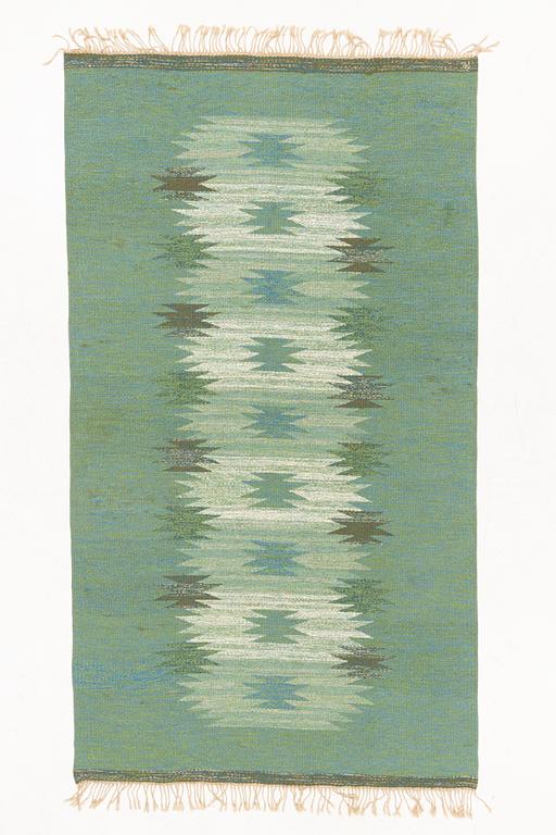 A flat weave rug, signed ML, c. 270 x 150 cm.