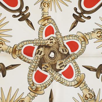 Hermès, a 'Les Eperons' silk scarf.