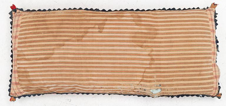 An embroidered carriage cushion, 100 x 50 cm, dated 1852.