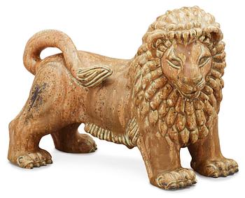 839. A Gunnar Nylund stoneware figure of a lion, Rörstrand.