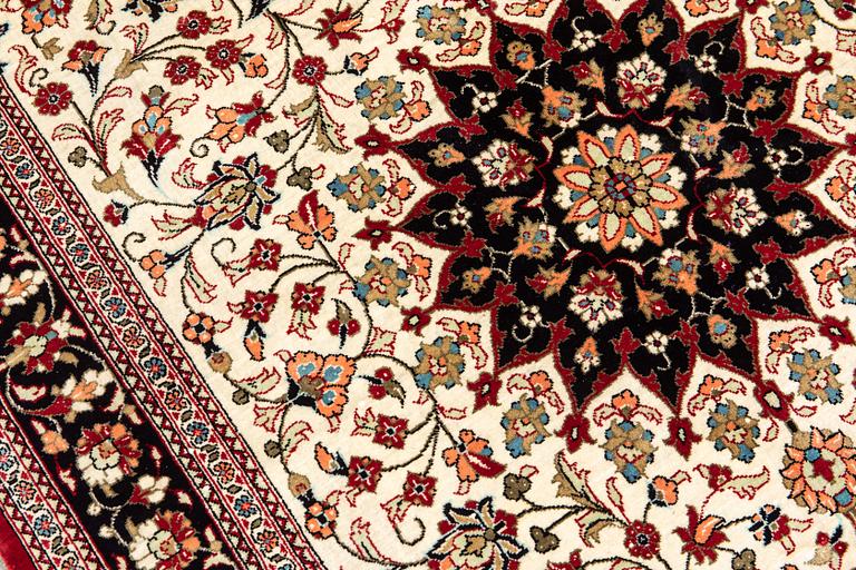 A carpet, Silk Qum, ca 116 x 75 cm.