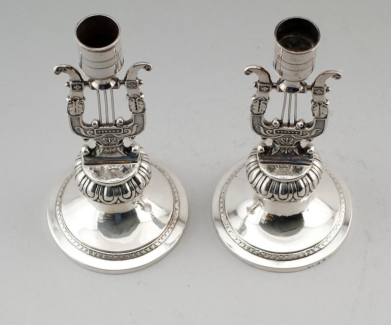 LJUSSTAKAR, 1 par, silver, Anders Lundqvist, Stockholm 1817 och 1829. Vikt ca 344 g.