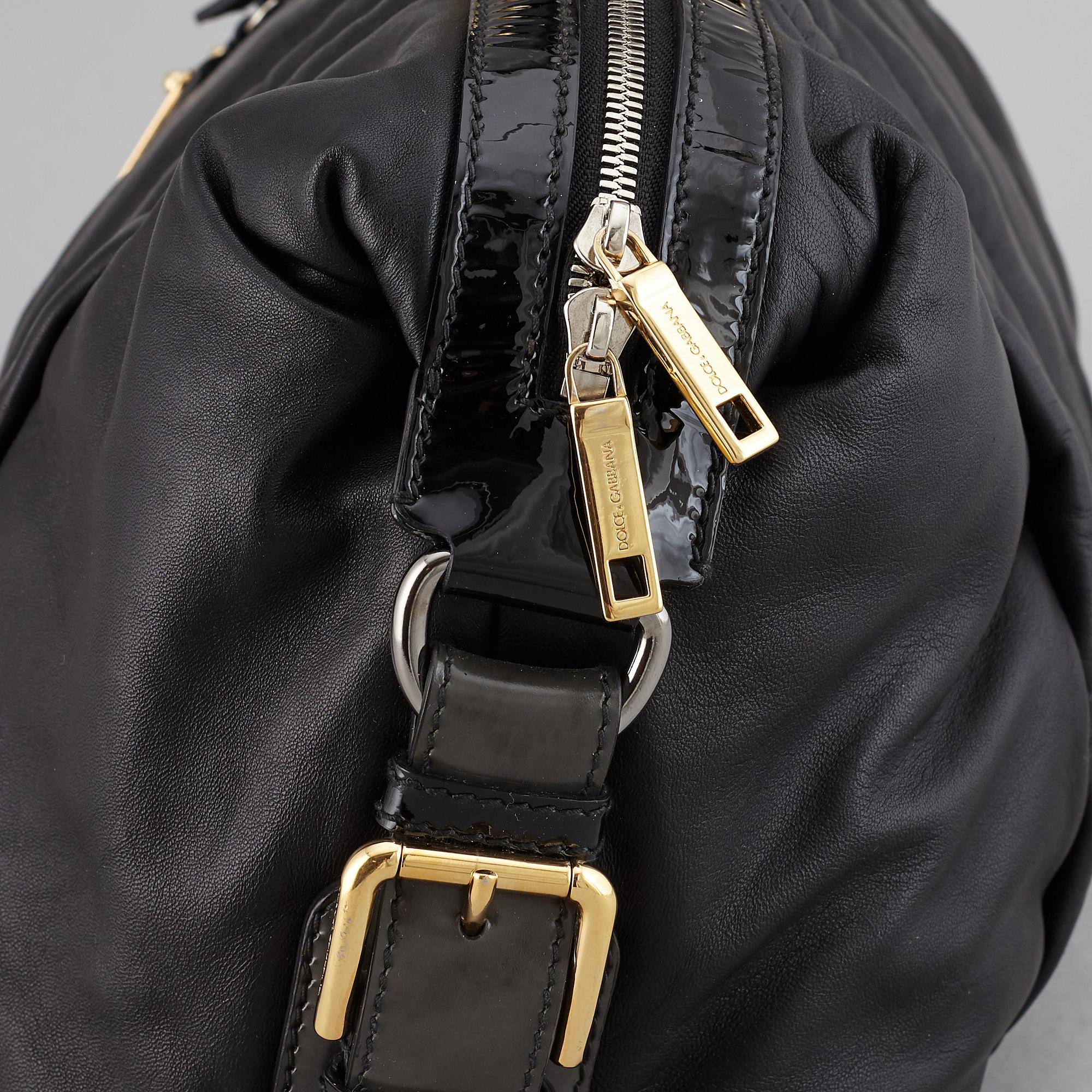 DOLCE & GABBANA, a black leather bag.