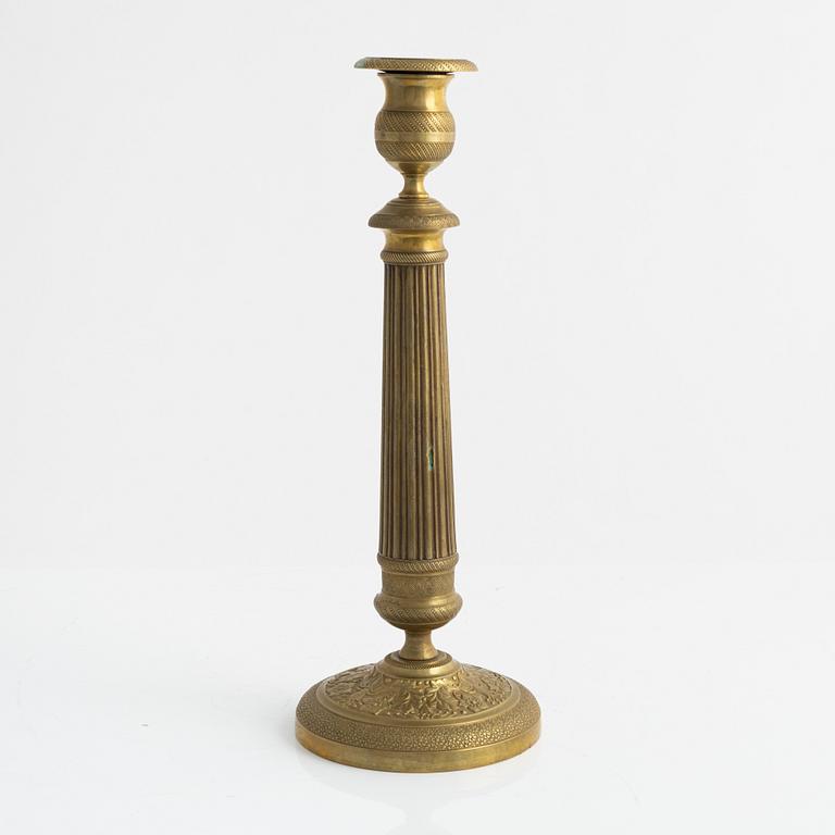 A brass Empire candlestick, first half of the 19th century,
