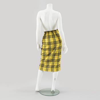 A checkered skirtby Jean Paul Gaultier.