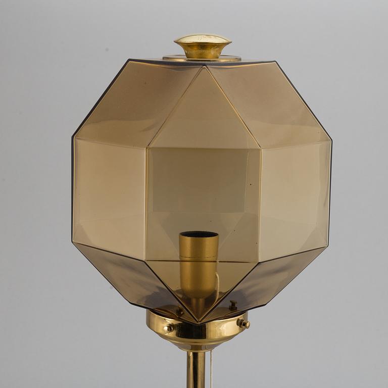 A decond half of the 20th Century brass and glass table light from Bergboms.