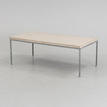 A modern sofa table with concrete top and steel legs.