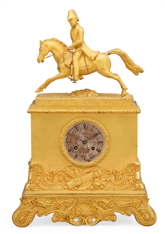 A Swedish Empire Equestrian gilt bronze mantel clock depicting king Karl XIV Johan.