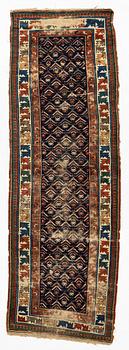 A antique Kazak gallery carpet, ca 310 x 105 cm.