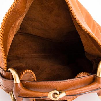 Gucci, a 'Horsebit Hobo' bag.