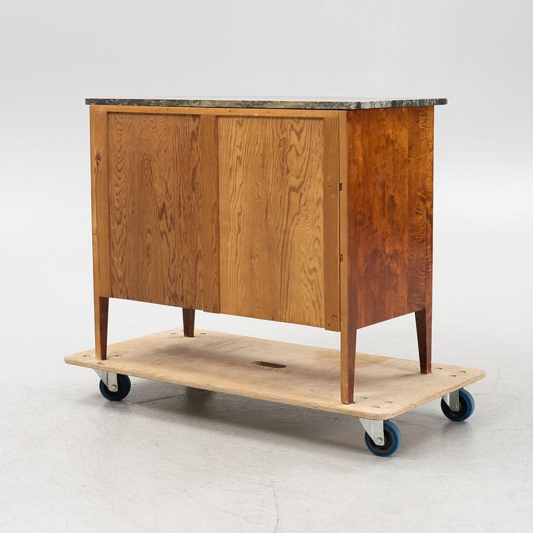 A mahogany and birch veneered dresser with a stone top.
