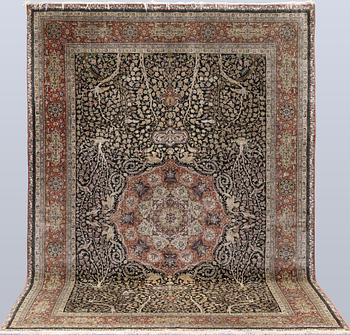 A oriental silk carpet, 303 x 201 cm.
