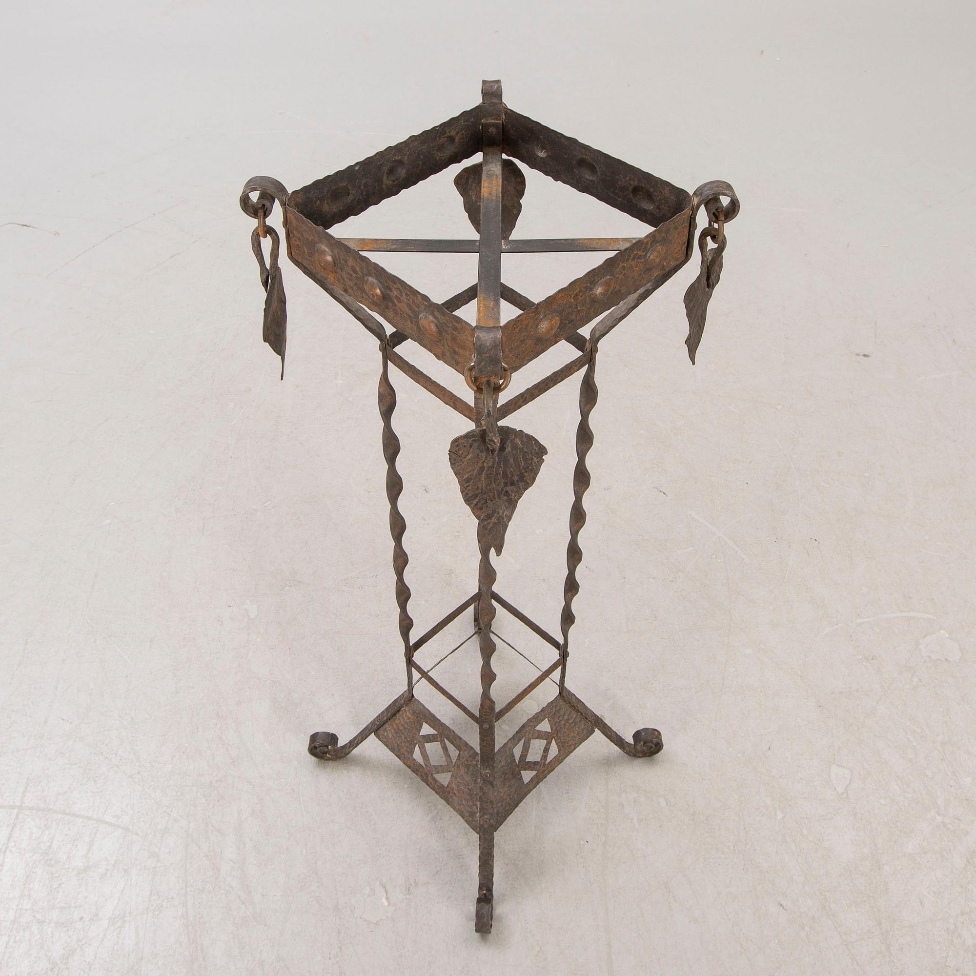 A metal pedestal and urn early 1900s.