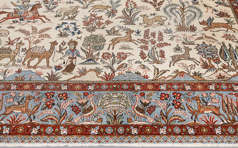 A semi-antique Ghom carpet, approx. 390 x 290 cm.