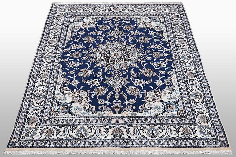 A carpet, Nain, part silk, ca 202 x 148 cm.