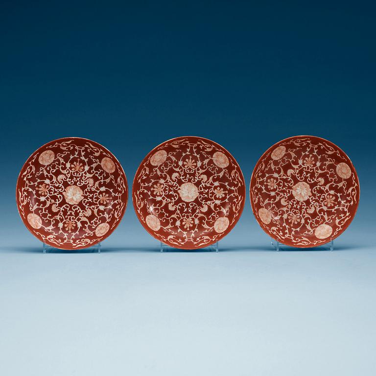 A set of three coral red dishes, Qing dynasty, with Daoguang seal mark.