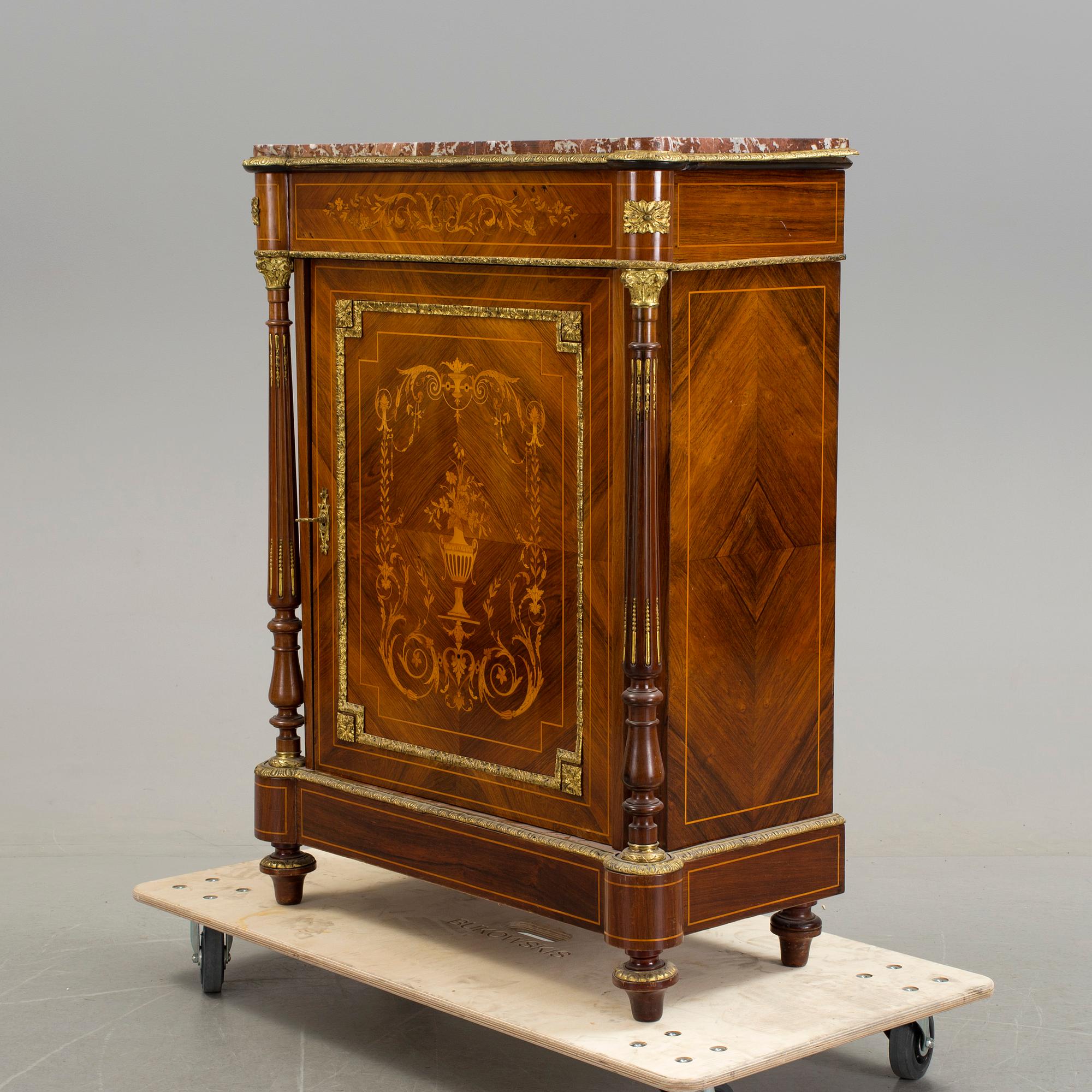 An early 20th century Louis XVI style cabinet.