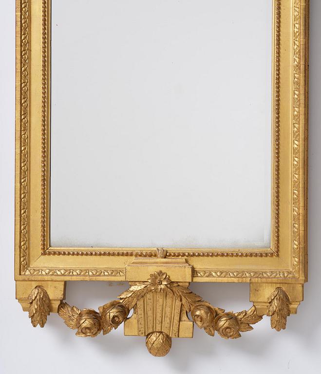 A Gustavian giltwood mirror by C. G. Fyrwald (master in Stockholm 1776-1825).