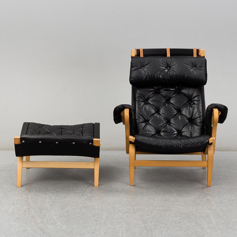 BRUNO MATHSSON, easy chair and foot stool, 'Pernilla', Dux, second half of the 20th century.