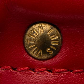 A RED EPI LEATHER KEEPALL 50 TRAVEL BAG.