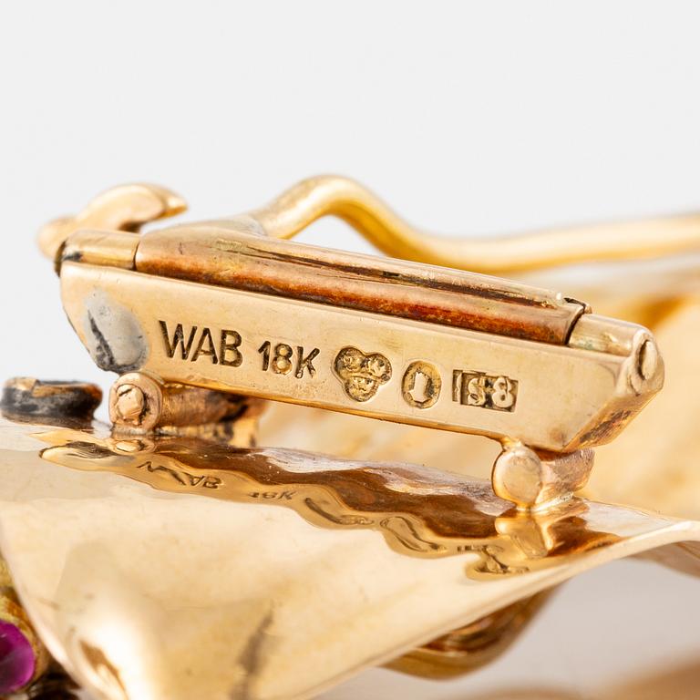 A W.A. Bolin brooch 18K gold set with cabochon-cut rubies and rose-cut diamonds, Stockholm 1944.