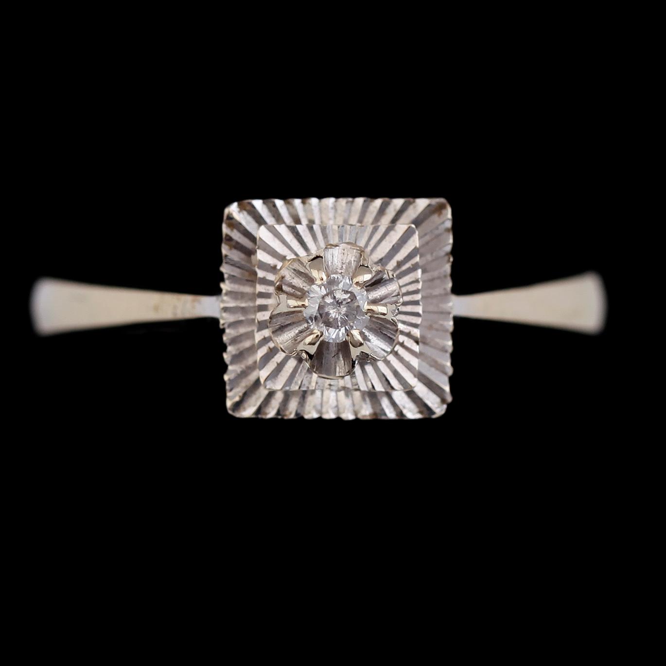 RING, 18 k vitguld med briljantslipad diamant ca 0.04 ct. Total vikt ca 3 gram.
