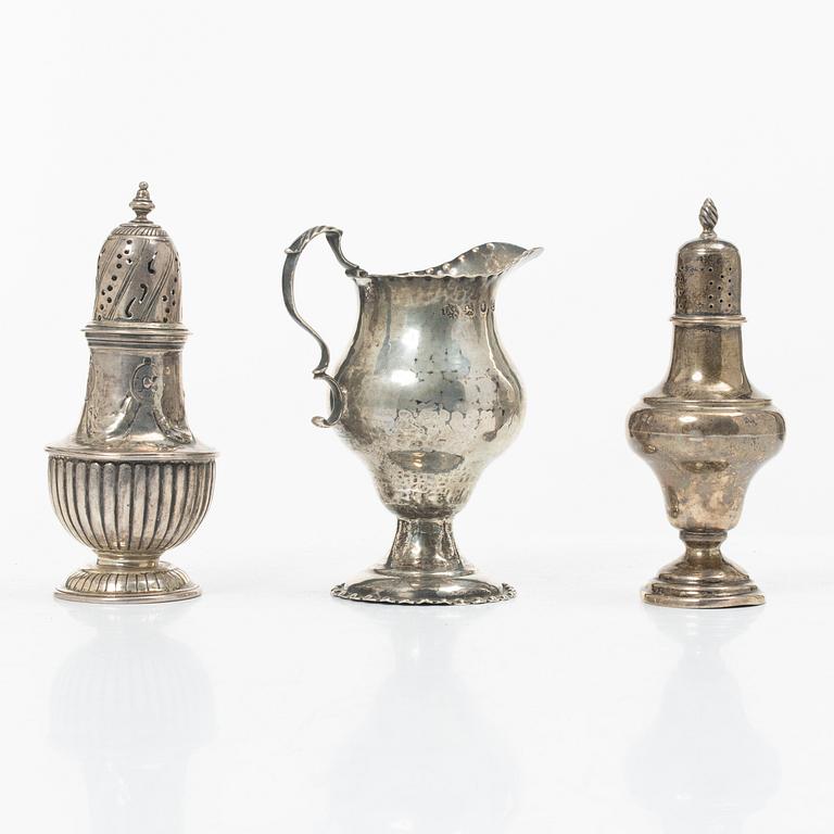 Two silver casters and cream jug, England.