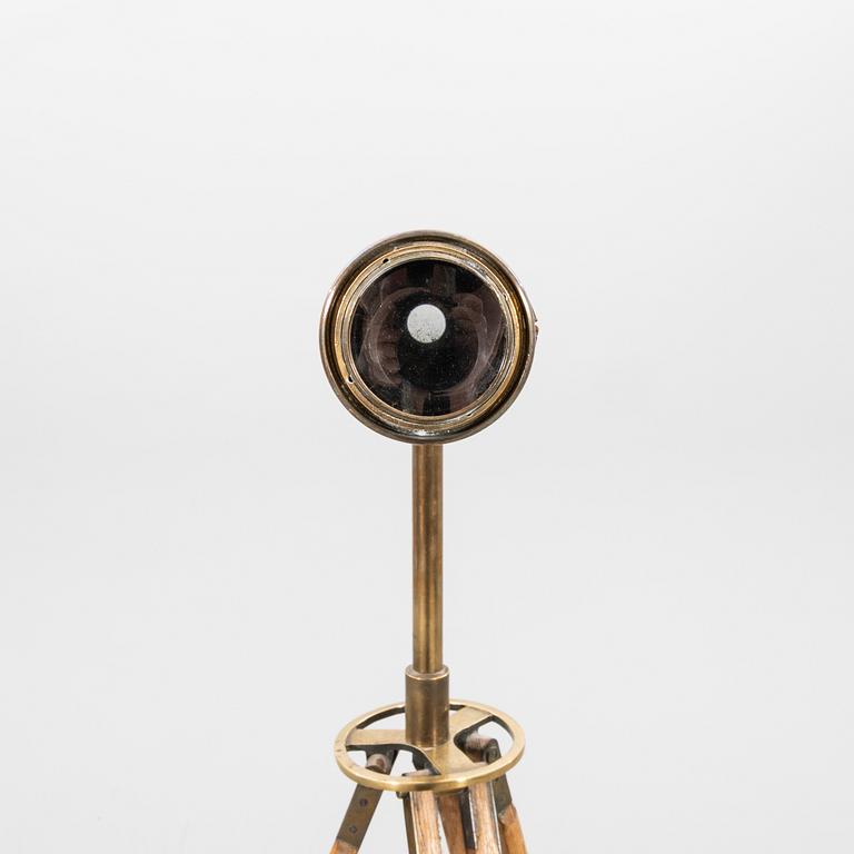 A brass and leahter tube binocular with stand around 1900.