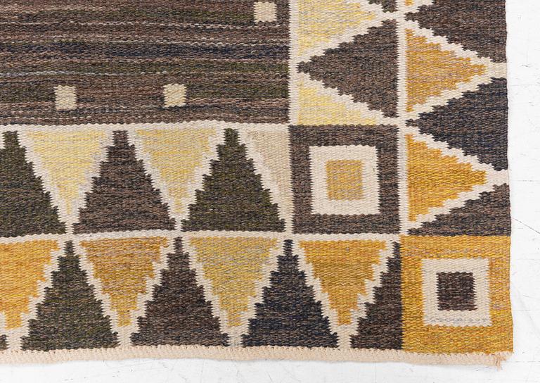 A flat weave rug, c. 245 x 185 cm.
