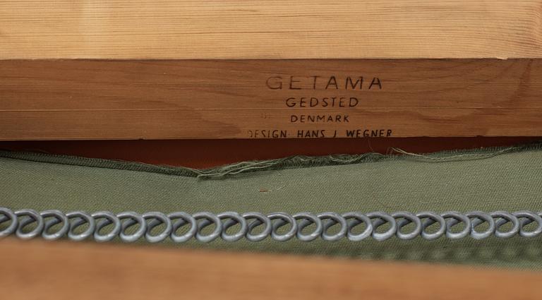 A Hans J Wegner oak and brown leather sofa,