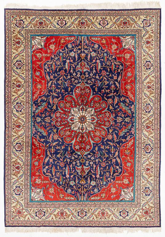 A semi-antique Tabriz, c. 349 x 249 cm.