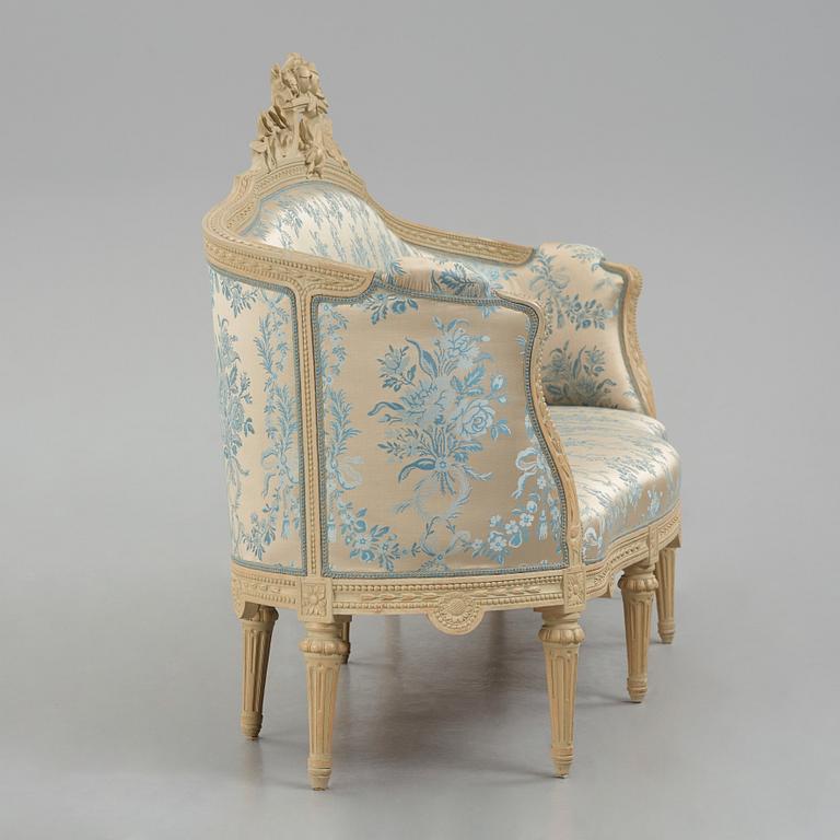 A grey-painted Gustavian 'canapé en corbeille'. sofa, later part of the 18th century.