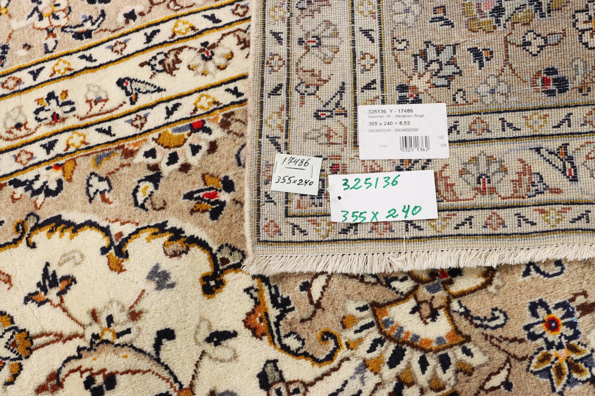A Keshan carpet, c. 355 x 240 cm.
